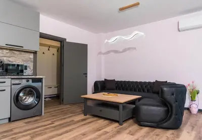a living room with a couch and a table at Apartment Maritsa View 2 in Plovdiv