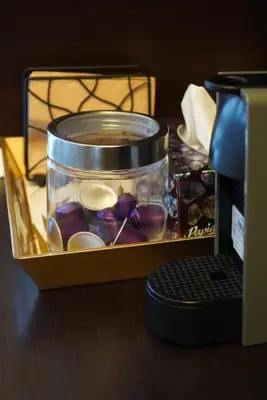 a container of jelly beans sitting next to a computer keyboard at Pirin Elegance Apartment by Gondola Lift in Bansko