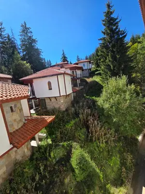 an aerial view of a building with trees and bushes at Апартамент Орфинда- Pamporovo in Pamporovo