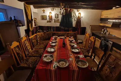 a long table with plates and dishes on it at Дядо Пановата къща