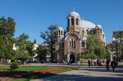 a church with people walking in front of it at Retro-Chic 1BR Apartment next to Vasil Levski Blvd by Flat Mаnager in Sofia