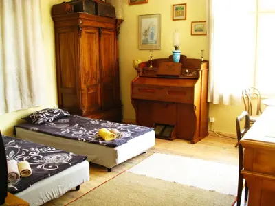 a living room with two beds and a dresser at Maritsa River Apartment in Plovdiv