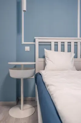 a bedroom with a bed and a glass table at Stylish & Funcional 1 BDRM apt in Sofia's heart in Sofia