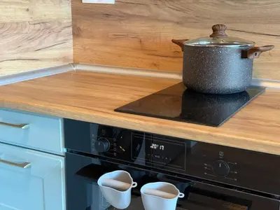 a pot on top of a stove in a kitchen at SkyWay by NightSpace- Modern City Apartment in Sofia
