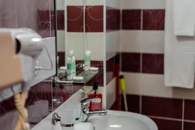 a bathroom with a sink and a mirror at 2R Ski - ТуЕр Ски in Smolyan