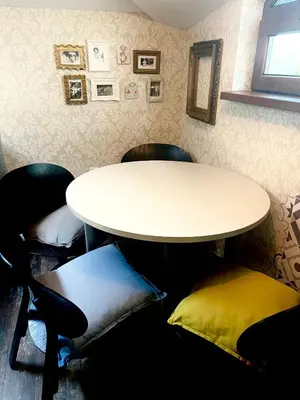 a table and chairs in a room with a table at Kate House in Sofia