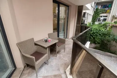 a balcony with a table and chairs on a building at Top Central Apartment 14 in Sofia