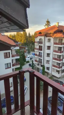 a view of a parking lot from a balcony at Borovets Apartments, Flora Violet Residence in Borovets