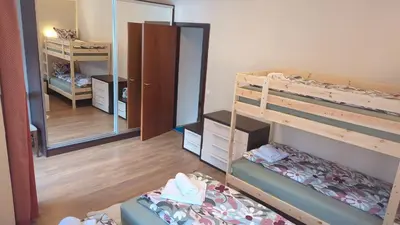 a bedroom with two bunk beds and a mirror at Borovets Apartments, Flora Violet Residence in Borovets