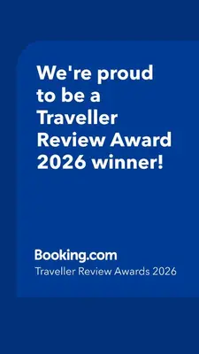 a blue sign that says were proud to be a traveller reviewagency winner at Cozy Apartment in Lozenetz by 7th Sence in Sofia