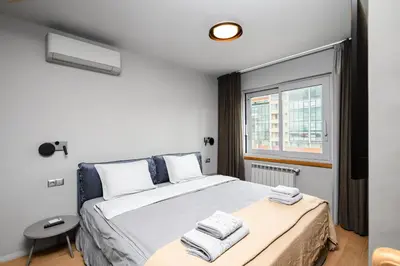 a bedroom with a bed and a window at Cozy Apartment in Lozenetz by 7th Sence in Sofia
