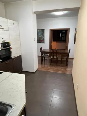 a kitchen and dining room with a table and a dining room at Cinema house at Sofia center in Sofia