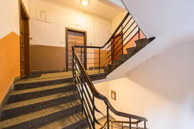 a staircase in a building with a stair case at The Pearl Downtown in Sofia