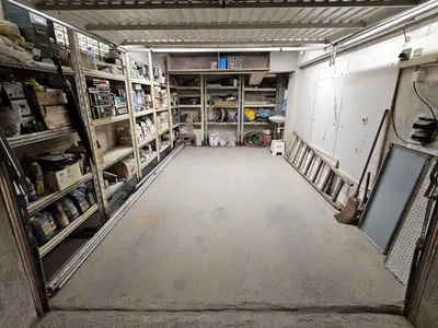 an empty garage with a room with shelves at Bright and Cozy Studio with Garage near the Center in Sofia