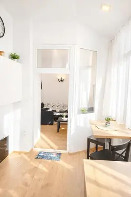 a living room with a table and a dining room at Stylish apartment, top center with private Sauna! in Sofia
