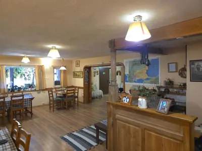 a living room with a table and a dining room at Къща за гости У Нико in Orehovo