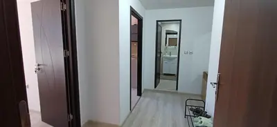 a hallway leading to a bathroom with a toilet at Апартаменти Борови хълмове in Pamporovo
