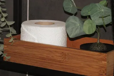 a roll of toilet paper sitting on a wooden shelf at TwinStay #6 - Deluxe Super King Suite in Sofia