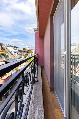 a balcony with a view of a city at Stylish City Escape 1BD Apartment in Plovdiv in Plovdiv