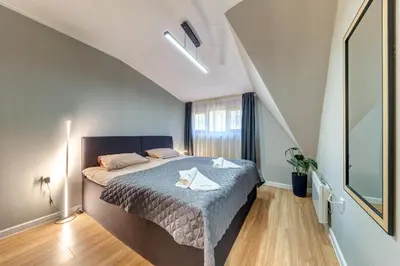 a bedroom with a bed with two towels on it at Top floor Ski-In Stay in Pamporovo