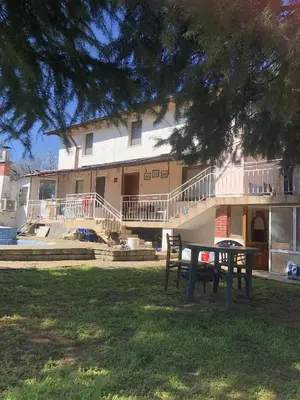 a building with a bench in front of it at Country House БатЖоро