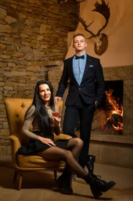 a man in a tuxedo standing next to a woman at Grand Resort Pamporovo Apartments in Pamporovo