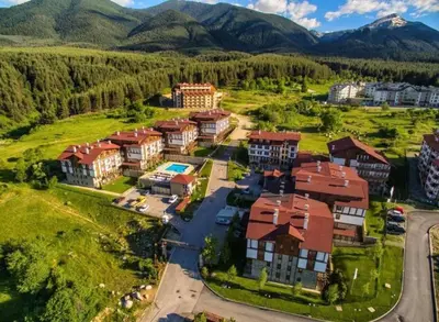 an aerial view of a campus with mountains in the background at Appartement moderne et chic Ski & Spa Bansko in Bansko
