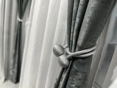 a group of baseball equipment hanging from a curtain at Le bijou-Беломорски in Plovdiv
