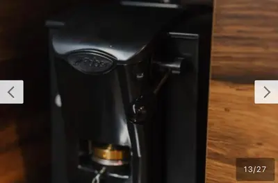 a black coffee machine with two arrows pointing to the right at Le bijou-Tomov Plaza in Plovdiv