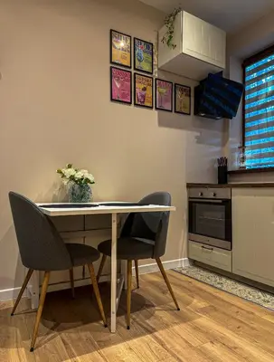 a kitchen with a table and two chairs at Heart of Sofia Apartment in Sofia