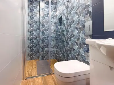 a bathroom with a shower with a toilet at Stylish 2-Bedroom Sofia Stay in Sofia