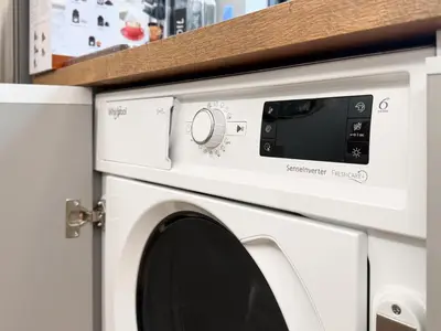 a white washer and dryer in a kitchen at Stylish 2-Bedroom Sofia Stay in Sofia