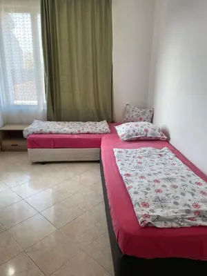 two beds sitting next to each other in a room at Casa De Zambini in Plovdiv