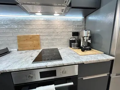 a kitchen with a stove and a counter top at Diamond Apartment in Plovdiv
