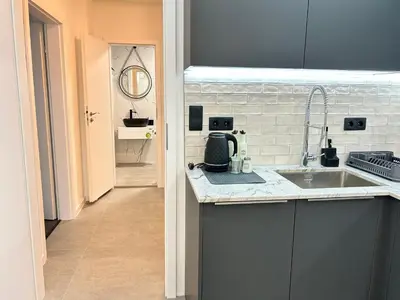 a kitchen with a sink and a counter top at Diamond Apartment in Plovdiv