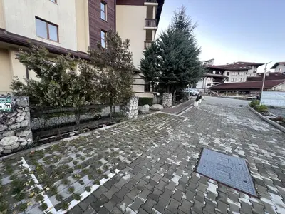 a cobblestone street in front of a building at Flat F6 Bansko Rentals in Bansko