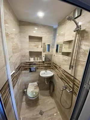 a bathroom with a sink and a shower at Apartment PS in Sofia