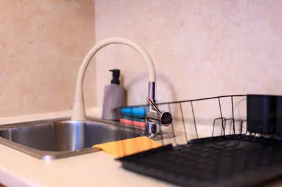 a kitchen sink with a keyboard next to a faucet at Cozy Central Apartment By NDK and Vitosha Blvd with Free secured parking and two terraces in Sofia