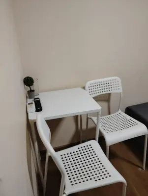 a table and two chairs and a white table and chairs at Let's Go Party - Plovdiv Center in Plovdiv