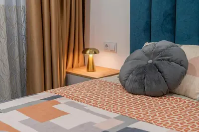a bedroom with a bed with a pillow on it at Luxury & Modern Apartment - Rowing Canal Plovdiv in Plovdiv