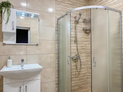 a bathroom with a shower and a sink at One-Bedroom Apartment next to Mall Plovdiv with Free Street Parking in Plovdiv