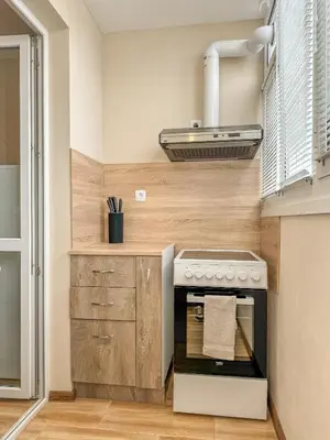 a kitchen with a stove and a sink at One-Bedroom Apartment next to Mall Plovdiv with Free Street Parking in Plovdiv