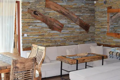 a living room with a couch and a table at Villa Pamporovo in Pamporovo