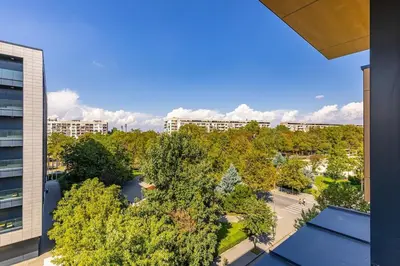 an overhead view of a city with trees and buildings at Royal Garden apartment with Private Parking in Plovdiv