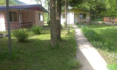 a campsite with a path in front of a yard at Guest House Rainbow in Cherni Osŭm