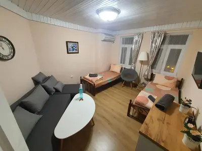 a living room with a couch and a table at Guest House Old City Plovdiv in Plovdiv