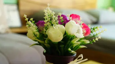 a bouquet of flowers in a vase on a table at The BlackPeak View Apartment in Sofia