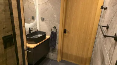 a bathroom with a black sink and a shower at LUXURY Designer Apt I Meters to Gondola Lift I Sleeps 6 I Pool & Parking I in Bansko