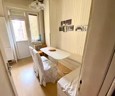 a small room with a white table and a chair at Happy Appointment in Sofia