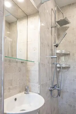 a bathroom with a sink and a shower at Old Town Bijou in Sofia